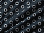 Black and white fabric featuring a repeating pattern of stylized sunburst eyes and small stars, with a diagonal satin-like sheen.
